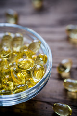 Omega-3 capsules in the glass bowl