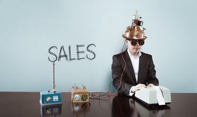 Sales concept with vintage businessman and calculator