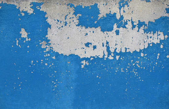 Flakes Of Old Blue Paint On Grey Concrete Wall