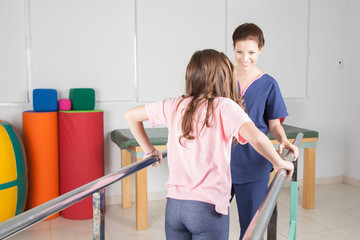  Physical therapist with patient in rehabilitation