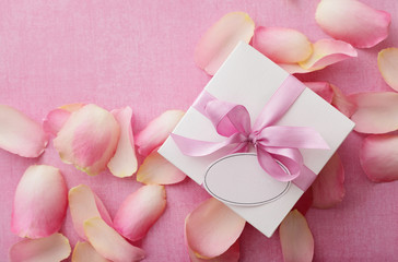gift box with blank gift tag and pink ribbon bow