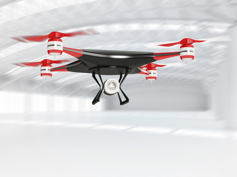 black quadcopter drone with HD camera in flight in interior warehouse