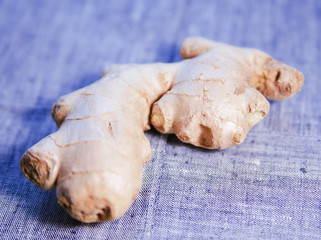Ginger or fresh ginger on a background