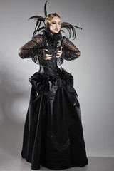 Fototapeta na wymiar Extravagant lady in a black dress
