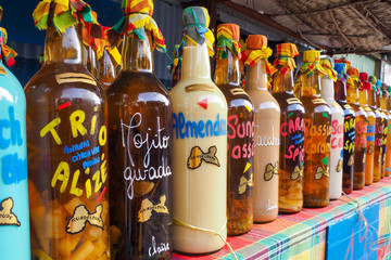 Rhum ti-punch bottles assortment on market stall