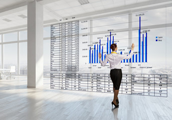 Businesswoman in top floor office