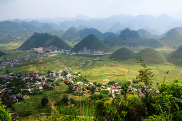 Fototapeta na wymiar Double mountain named 'Nui Doi', Quan Ba, Ha Giang, Vietnam. Its shape is the same as 'Two Breasts' of lady, lie in the middle of the field. It is an unique landscape of Dong Van Karst Plateau Geopark