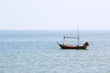 Naklejka na ściany i meble alone local fishery boat floating at sea