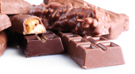 Mix of chocolate bars on table, close-up