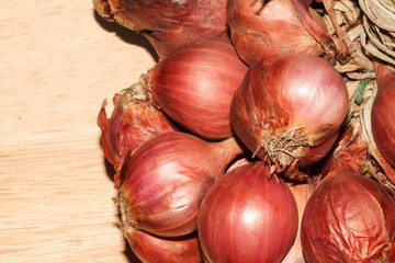 Shallot onions on brown wooden