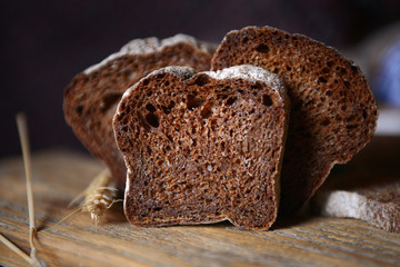 Sliced bread with ears on cutting board closeup