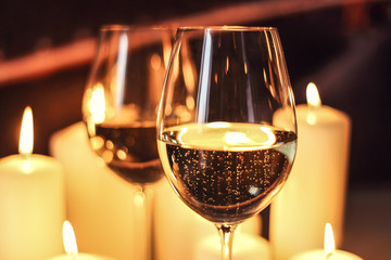 glasses with champagne and candles