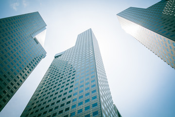 Obraz na płótnie Canvas Skyscraper building at singapore - blue whitebalance and green p