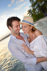 Obraz premium Portrait of cheerful couple on vacation in Caribbean island