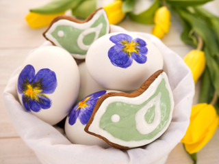 Painted Easter eggs and green bird shaped cookies