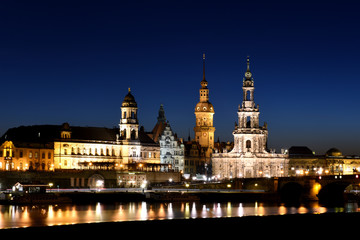 Fototapeta na wymiar Dresden, Germany - The Catholic Church of the Royal Court of Saxony seen from the Elbe river at sunset.