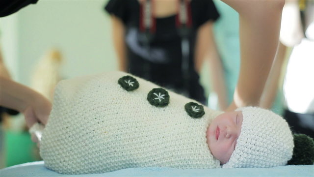 Newborn baby is prepared for photo session