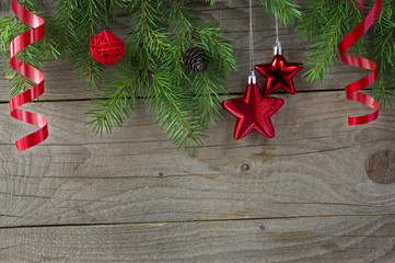 Christmas tree sprigs on wooden background. Winter holidays back