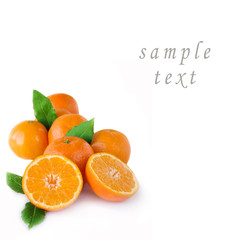 Ripe tangerines with leaves isolated on white background