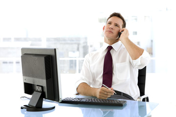  Businessman on the phone at workplace 