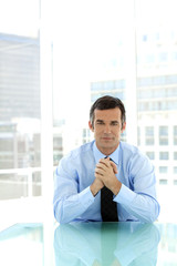 Fototapeta premium Portrait of a male business manager at workplace