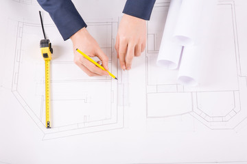 Male hands drawing an architecture project.