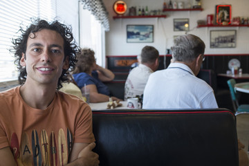 young man in an american diner
