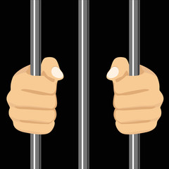person locked behind bars