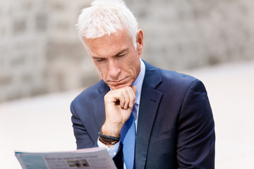 Portrait of confident businessman outdoors