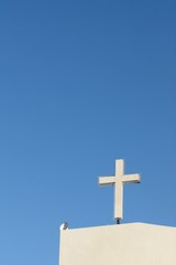White church cross with blue sky
