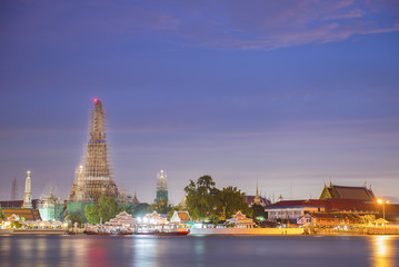 Fototapeta premium Wat Arun Temple under construction in twilight time at bangkok t