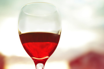 Glass of red wine on blurred background