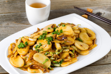 Chinese stir fry sticky rice slices and vegetable dish 