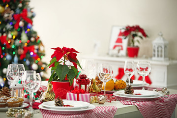 Christmas table setting on light room background