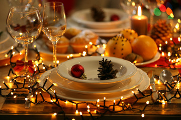 Fototapeta na wymiar Christmas table setting with holiday decorations