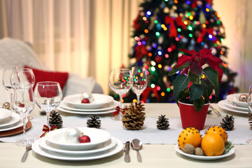 Christmas table setting with holiday decorations background