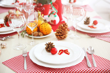 Christmas table setting with holiday decorations