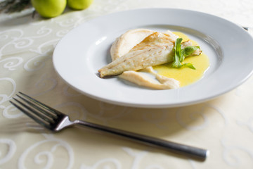 dietary dish of white fish in sauce