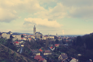 Fototapeta na wymiar Panoramic view on the Czech historical town of Kutna Hora, located close to Prague and well-known for its Ossuary (Bone Church). Filtered in faded, retro style wtih soft focus.