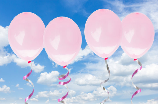 pink baloons in the sky