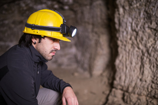 speleologist inside cave
