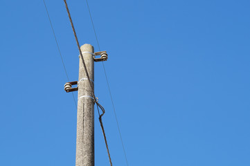 electricity pylon with blue sky background
