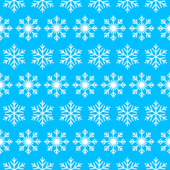 Seamless pattern with snowflakes on the blue background.