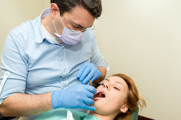 Dentist doing a dental treatment on a patient