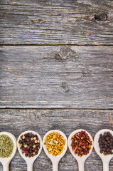 Obraz na płótnie Canvas Spices on wooden spoons