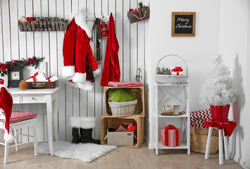 Interior of Santa Claus home on white wooden wall