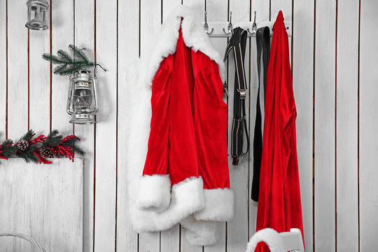 Santa Suit On A White Wooden Wall