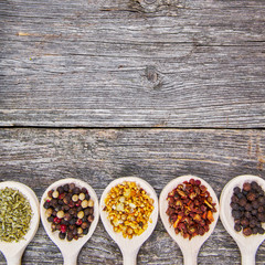 Spices on wooden spoons