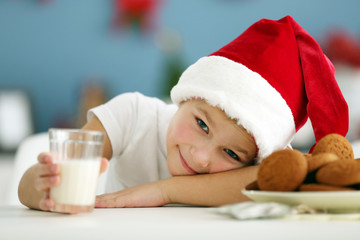 Portrait of cheerful boy in decorated Christmas room, close up