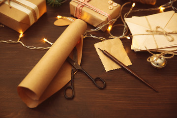 Wrapping Christmas gifts and writing greeting card